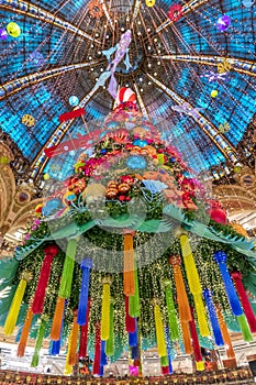 The Christmas tree under the dome of the Galeries Lafayette. The Galeries Lafayette has been selling luxury goods since 1895