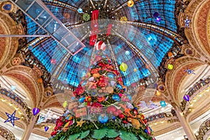 The Christmas tree under the dome of the Galeries Lafayette. The Galeries Lafayette has been selling luxury goods since 1895