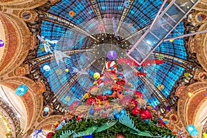 The Christmas tree under the dome of the Galeries Lafayette. The Galeries Lafayette has been selling luxury goods since 1895