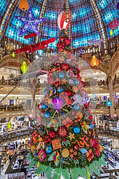 The Christmas tree under the dome of the Galeries Lafayette. The Galeries Lafayette has been selling luxury goods since 1895