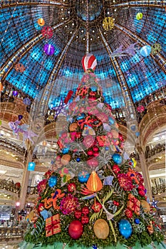 The Christmas tree under the dome of the Galeries Lafayette. The Galeries Lafayette has been selling luxury goods since 1895