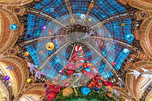 The Christmas tree under the dome of the Galeries Lafayette. The Galeries Lafayette has been selling luxury goods since 1895