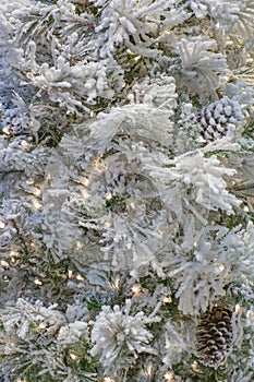 Christmas tree with white artificial snow covering