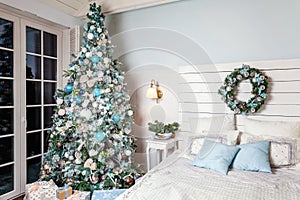Christmas tree with white, blue and silver decorations