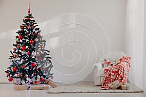 Christmas tree in a white room for Christmas with gifts