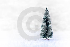 Christmas tree on white snow, light bokeh backgrounds ,Merry Christmas and happy New Year