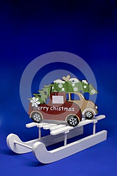 Christmas tree on wooden sleigh, Christmas holiday celebration concept.Merry Christmas and Happy New Year greeting card