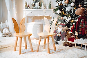 christmas tree and wreath, stars, gifts and decoration. Family time photo corner.