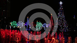 Christmas trees and colorful water fountains.