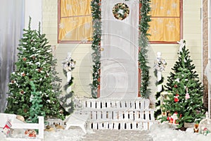 Christmas trees with gifts underneath in courtyard photo