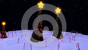 Christmas trees, light decorations with yellow stars on top, standing in a snowy ground in the night