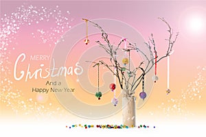 Christmas twig tree, baubles and bells. Coral background. Text.