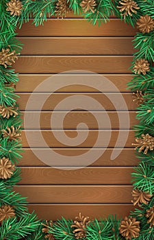 Christmas vertical wooden background with pine branches and cones.