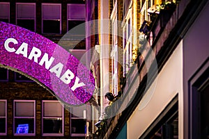 A Christmas view of Carnaby Street, a pedestrianised shopping street in Soho in the City of Westminster in London