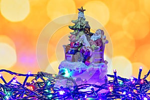 Christmas vintage toy decoration against golden bokeh background
