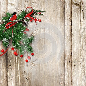 Christmas vintage wooden background with fir branches, bullfinch