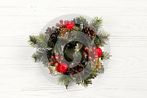 christmas vintage wreath on stylish rustic white wooden background. space for text. holiday greeting card concept. unusual