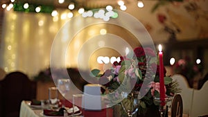 Christmas wedding banquet hall interior details with decorand table setting at restaurant. Winter season decoration of