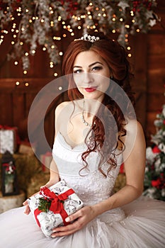 Christmas wedding. Happy bride with gft. Marriage concept
