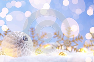 Christmas white ball with snowflakes on snow