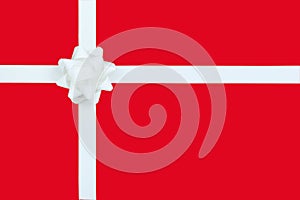 Christmas White Bow and ribbon on red paper background