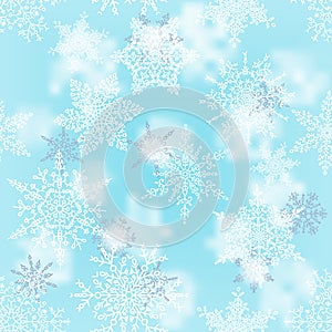 Christmas white and silver snowflakes on blur blue background. Winter holiday pattern. Greeting card. Vector