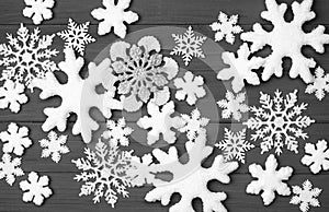 Christmas White Snowflakes Background on Rustic Gray Wood Boards photo from an above, looking-down view in Horizontal that can be