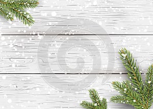 Christmas white wooden background with holiday fir tree branches, pine cone and falling shiny snow. Flat lay, Top view with copy s