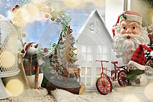 Christmas window decoration with winter scenery and seasonal figurines