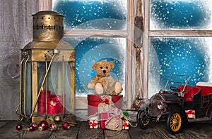 Christmas window sill decoration with old nostalgic toys.