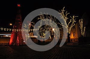 Christmas winter city night time scene with lit trees