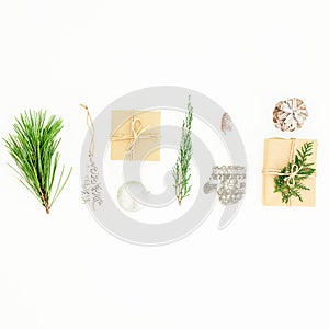 Christmas winter composition with gifts box, decorations, tree branches and pine cone on white background. New year concept. Flat