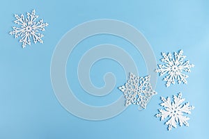 Christmas or winter composition. Pattern made of white snowflakes on pastel blue background. Christmas, winter, new year concept.