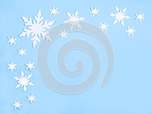 Christmas or winter composition. Pattern of snowflakes on a pastel blue background. Christmas, winter, new year concept. Flat lay