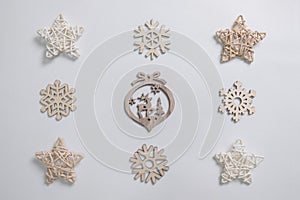 Christmas winter festive ornament. Christmas snowflakes decoration and wooden stars on white background. Christmas holiday