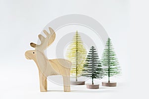 Christmas winter festive ornament. Reindeer and pine tree decoration on white background. Minimal holiday greeting season