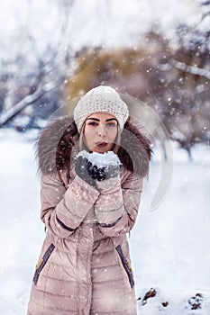 Christmas Winter Woman blowing Magic snow in Her Hand. Fairy. Be