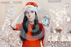 Christmas Woman with Alarm Clock Waiting for Santa Claus