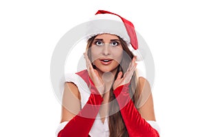 Christmas Woman. Beauty Model Girl in Santa Hat isolated on Whit