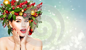 Christmas Woman Beauty in Xmas Wreath. New Year Fashion Model Happy Laughing, Open Mouth. Emotional Face, Red Lipstick over Snow