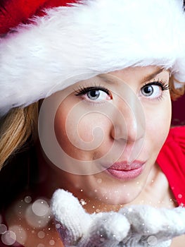 Christmas woman blowing starlight dust