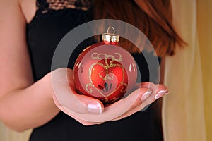 Christmas woman hand with ball