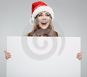 Christmas woman hold big white card. Santa hat. Isolated