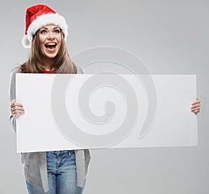Christmas woman hold big white card. Santa hat. Isolated