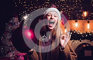 Christmas woman hold bomb. Crazy merry Christmas and Happy New Year. Crazy comical face. Young funny woman wink. Comic