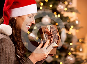 Christmas. Woman opening Gift box