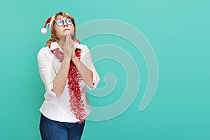 Christmas woman in shirt and jeans on blue background