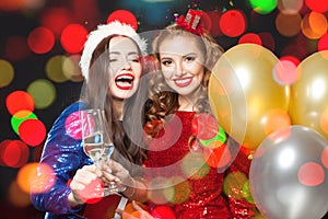 Christmas women on abstract bokeh glitter sparkle party background