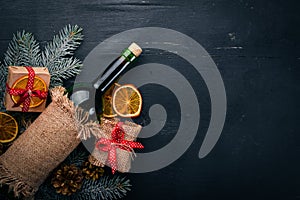 Christmas wooden background. A bottle of wine.