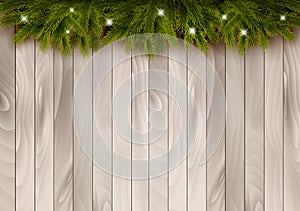 Christmas wooden background with branches and baubles.